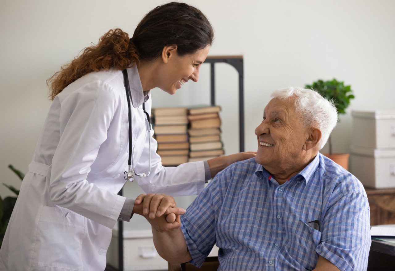 Nurse assisting senior man